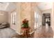 Elegant foyer with decorative floors and walls that leads to a comfortable living space at 7134 E Sandia St, Mesa, AZ 85207