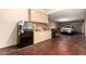 Spacious garage features refrigerator, cabinets, and parked car at 7134 E Sandia St, Mesa, AZ 85207