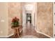 Hallway features beautiful floors, arched openings, and view of the spacious home interior at 7134 E Sandia St, Mesa, AZ 85207