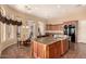 Kitchen with center island, stainless appliances and granite counters at 7134 E Sandia St, Mesa, AZ 85207