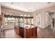 Modern kitchen with a center island, stainless steel appliances, and plenty of natural light at 7134 E Sandia St, Mesa, AZ 85207