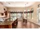 Well-appointed kitchen with a center island, granite counters, and views of the outdoors at 7134 E Sandia St, Mesa, AZ 85207