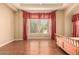 Bright bedroom with large windows and wood floors creating a warm, inviting atmosphere at 7134 E Sandia St, Mesa, AZ 85207