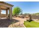 Outdoor patio with a built-in grill, fireplace, and desert views, perfect for entertaining at 7134 E Sandia St, Mesa, AZ 85207