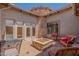 Picturesque outdoor patio with seating, decorative stone, and fire pit at 7134 E Sandia St, Mesa, AZ 85207