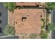 Aerial view showcases a custom-designed backyard, lush grass, built in grill and red tile roof at 7134 E Sandia St, Mesa, AZ 85207