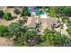 A bird's eye view captures a home with manicured greenery, a basketball court, and a sparkling swimming pool at 7214 E Royal Palm Rd, Scottsdale, AZ 85258