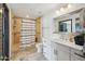 Updated bathroom features new vanity, tile shower, large mirror, and modern fixtures at 7214 E Royal Palm Rd, Scottsdale, AZ 85258