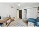 Inviting bedroom featuring a comfy blue sofa, desk space, and closet space at 7214 E Royal Palm Rd, Scottsdale, AZ 85258