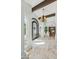 Inviting foyer with high ceilings, stone floors, and a decorative chandelier at 7214 E Royal Palm Rd, Scottsdale, AZ 85258