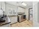 Modern laundry room with sleek countertops, stainless steel washer/dryer and cabinet storage at 7214 E Royal Palm Rd, Scottsdale, AZ 85258