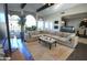Bright living room featuring a large sectional sofa, area rug, and modern design at 7214 E Royal Palm Rd, Scottsdale, AZ 85258