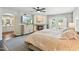 Spacious main bedroom with fireplace, decorative wallpaper, and French doors leading to the backyard at 7214 E Royal Palm Rd, Scottsdale, AZ 85258