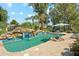 Beautiful pool with rock waterfall, lush landscaping, and cozy cabana area at 7214 E Royal Palm Rd, Scottsdale, AZ 85258