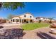 Spacious backyard featuring green grass and a patio, perfect for outdoor activities at 7421 S 25Th Ln, Phoenix, AZ 85041