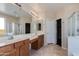 Bright bathroom with double sinks, modern fixtures, and a walk-in glass shower at 7421 S 25Th Ln, Phoenix, AZ 85041