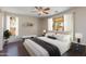 Bedroom featuring a ceiling fan, ample natural light, and a comfortable-sized bed at 7421 S 25Th Ln, Phoenix, AZ 85041