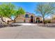 Charming two-story home features a three-car garage, mature landscaping, and a welcoming entrance at 7421 S 25Th Ln, Phoenix, AZ 85041