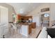 Open kitchen with granite countertops, stainless steel appliances, and a breakfast bar at 7421 S 25Th Ln, Phoenix, AZ 85041