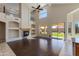 Bright, open living room with fireplace, soaring ceilings, and direct access to the backyard at 7421 S 25Th Ln, Phoenix, AZ 85041