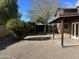 A spacious backyard with mature trees, a covered patio, and gazebo offers a relaxing outdoor retreat at 8117 W Dreyfus Dr, Peoria, AZ 85381