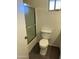 Functional bathroom features a glass-enclosed shower and a standard toilet for everyday comfort at 8117 W Dreyfus Dr, Peoria, AZ 85381