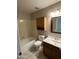 Full bathroom featuring tile floors, wood vanity, and a tub-shower combo at 8117 W Dreyfus Dr, Peoria, AZ 85381