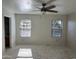 Bedroom featuring tile floors, neutral paint, and two windows dressed with blinds at 8117 W Dreyfus Dr, Peoria, AZ 85381