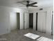 Bedroom featuring tile floors and sliding closet doors providing ample storage at 8117 W Dreyfus Dr, Peoria, AZ 85381