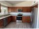 Updated kitchen featuring stainless steel appliances, modern cabinetry, and granite countertops at 8117 W Dreyfus Dr, Peoria, AZ 85381