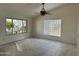 Bright living room featuring tile floors and two types of windows letting in ample natural light at 8117 W Dreyfus Dr, Peoria, AZ 85381