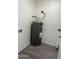 Utility Room featuring gray water heater, laminate floors, and white walls at 8117 W Dreyfus Dr, Peoria, AZ 85381
