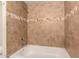 Bathroom tub and shower with tile surround including a horizontal accent at 8301 N 21St Dr # F102, Phoenix, AZ 85021