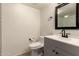 Bathroom featuring modern toilet and vanity with sleek dark fixtures at 8301 N 21St Dr # F102, Phoenix, AZ 85021
