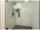 Bathroom with a glass-enclosed shower featuring sleek fixtures and subway tile at 8301 N 21St Dr # F102, Phoenix, AZ 85021