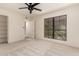 Bedroom featuring a window view, closet, and neutral carpet at 8301 N 21St Dr # F102, Phoenix, AZ 85021
