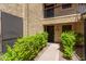 Well-maintained condo entrance with private patio and lush green landscaping at 8301 N 21St Dr # F102, Phoenix, AZ 85021