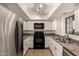 Bright kitchen features stainless steel appliances, white cabinets, and modern lighting at 8301 N 21St Dr # F102, Phoenix, AZ 85021