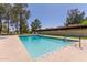Community swimming pool with a blue-tiled water feature and landscaping at 8301 N 21St Dr # F102, Phoenix, AZ 85021