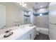 Bright bathroom features a dual vanity with white countertops and tub/shower combo with decorative tile at 9626 E Bunny Ear E Ln, Gold Canyon, AZ 85118