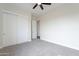Bright bedroom featuring closet and doorway at 9626 E Bunny Ear E Ln, Gold Canyon, AZ 85118