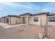 Charming home featuring desert landscaping with gravel, cacti, and natural stone accents at 9626 E Bunny Ear E Ln, Gold Canyon, AZ 85118
