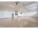 Bright and airy three car garage with epoxy flooring and bright lighting at 9626 E Bunny Ear E Ln, Gold Canyon, AZ 85118