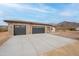Beautiful home with a spacious three car garage, desert landscaping and mountain views at 9626 E Bunny Ear E Ln, Gold Canyon, AZ 85118