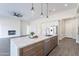 Open concept kitchen with an island, modern lighting, and a stainless steel dishwasher at 9626 E Bunny Ear E Ln, Gold Canyon, AZ 85118