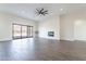 Open-concept living room with sliding glass doors and a modern fireplace at 9626 E Bunny Ear E Ln, Gold Canyon, AZ 85118