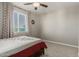 Bedroom with window, decorative curtains, neutral carpet at 9747 W Sands Dr, Peoria, AZ 85383