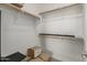 Picture of a walk-in closet with wooden rod shelving for storage at 9747 W Sands Dr, Peoria, AZ 85383