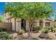 Single-Gathering home with desert landscaping and a covered porch entryway at 9747 W Sands Dr, Peoria, AZ 85383