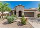 Beautiful single-Gathering home featuring desert landscaping and an arched entryway at 9747 W Sands Dr, Peoria, AZ 85383